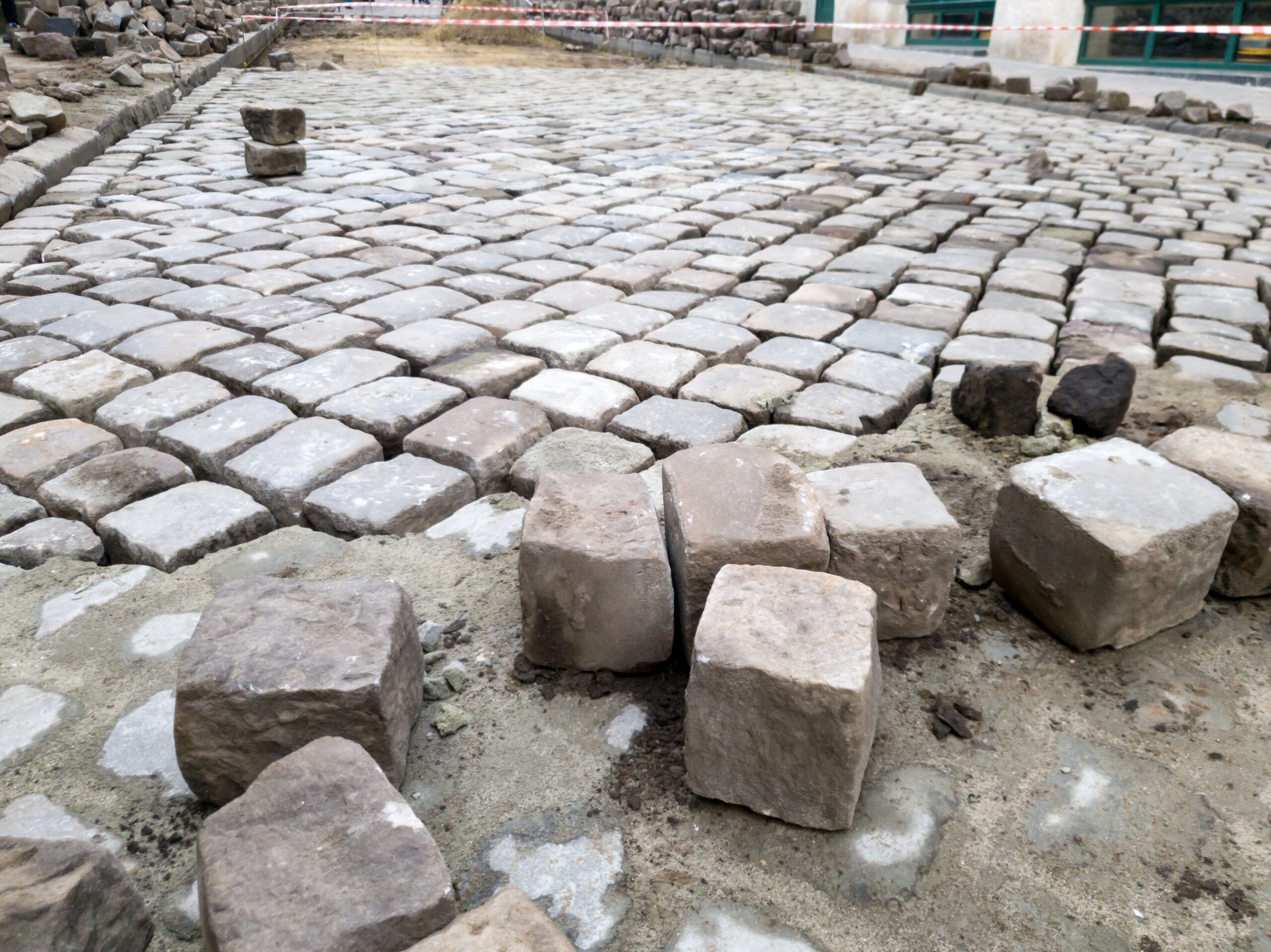 Closeup image of cobblestone pavement construction pn the old street